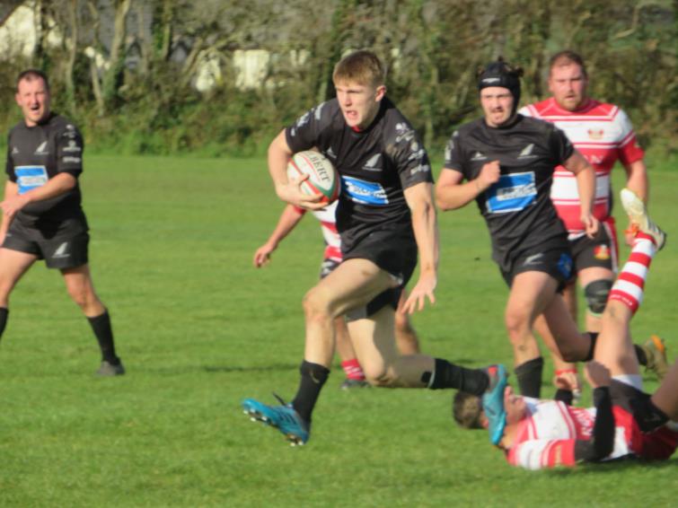 Tom Hughes on a charge for Neyland